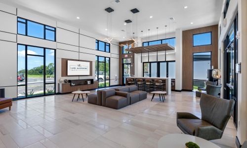 a room with a large glass door and a large white floor