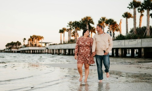 a man and woman standing in water