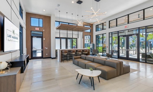 a large room with a large glass wall and a large tv