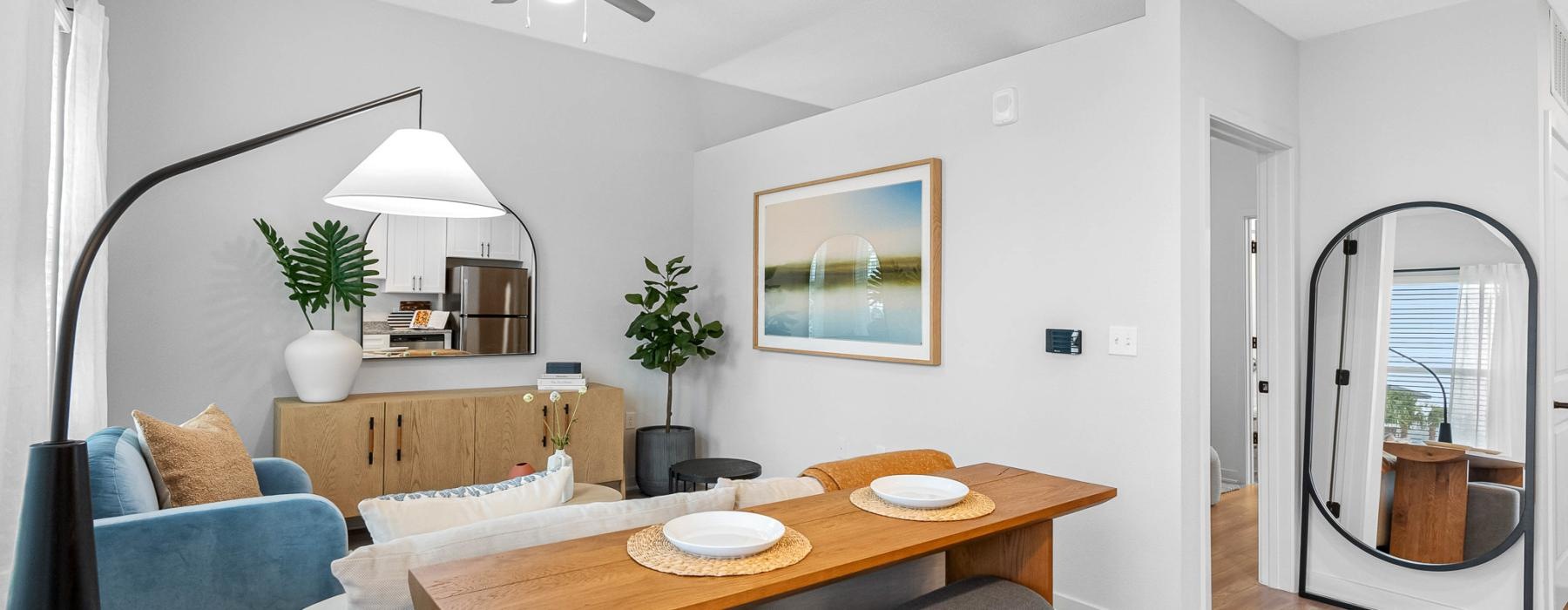 a living room with a table and chairs